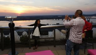 Family at Twilight Sky Terrace at the Madison Hotel. Photo Credit: Justin Fox Burks