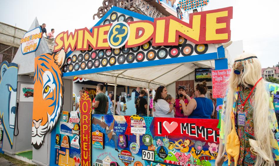 Swine &amp; Dine booth at World Championship Barbecue Cooking Contest.