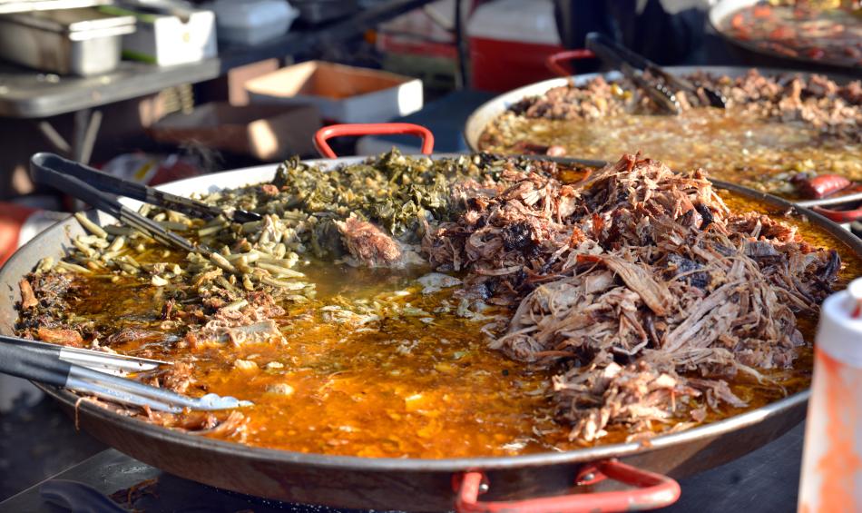 A barbecue and greens dish in a skillet at the World Championship Barbecue Cooking Contest.