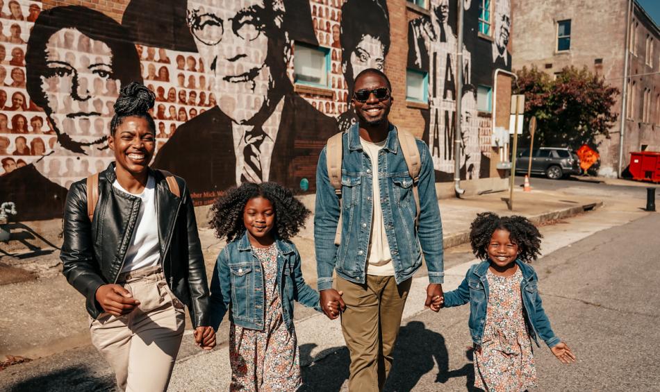Family in front of National Civil Rights Museum mural