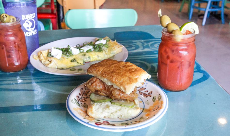 A biscuit, omelet and Bloody Mary on a table at Sunrise Memphis.