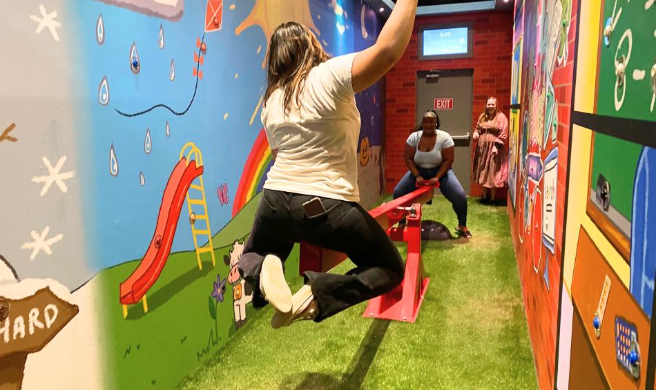 two girls on teeter totter at Amuse adventure museum