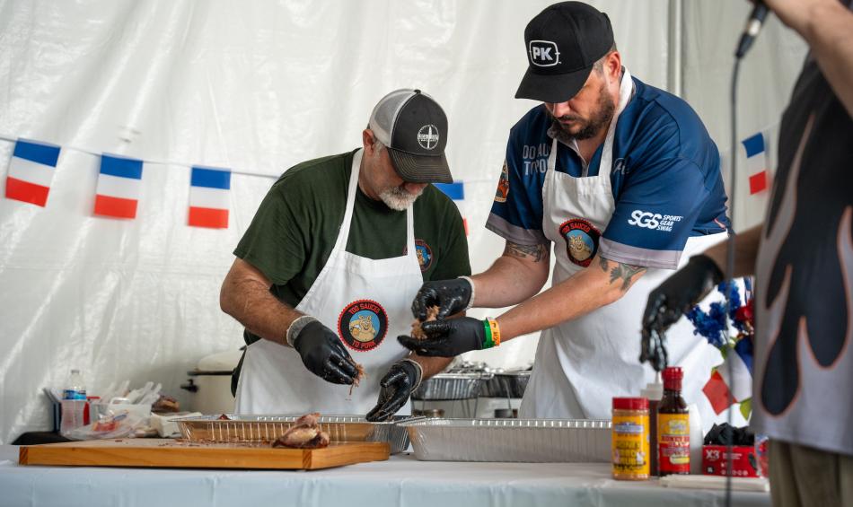 two men prepping barbecue at WCBCC