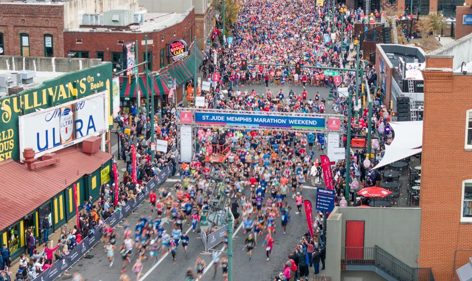 St. Jude Memphis marathon runners take off from starting line at the intersection of Beale Street