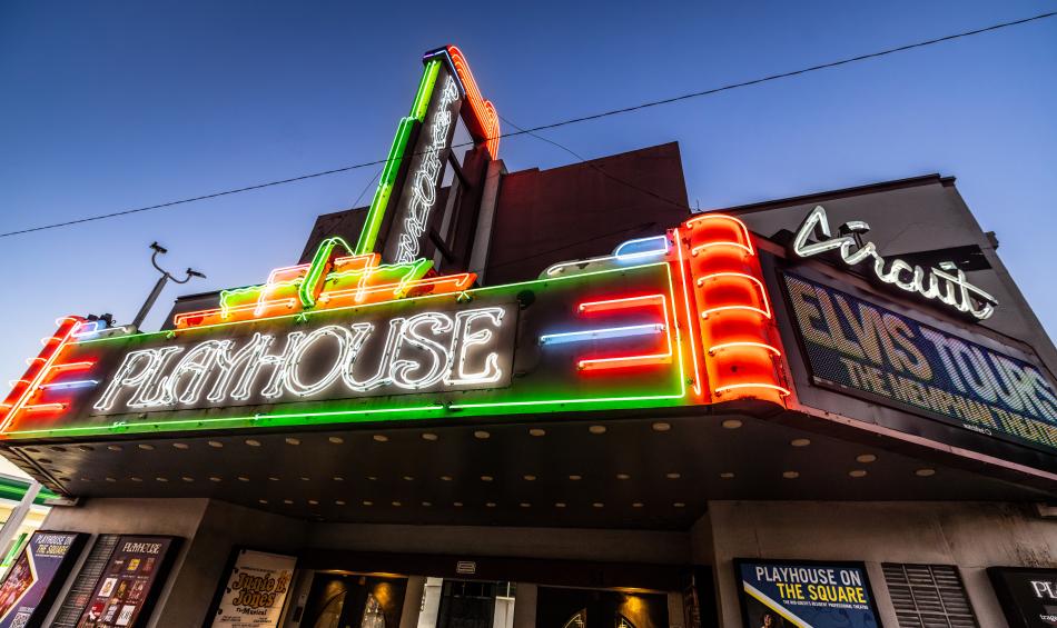 exterior neon lights of Playhouse Theatre sign