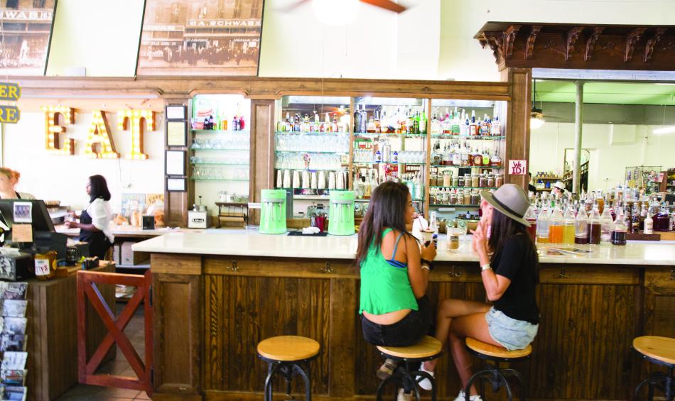 Two women eating ice cream at A. Schwab