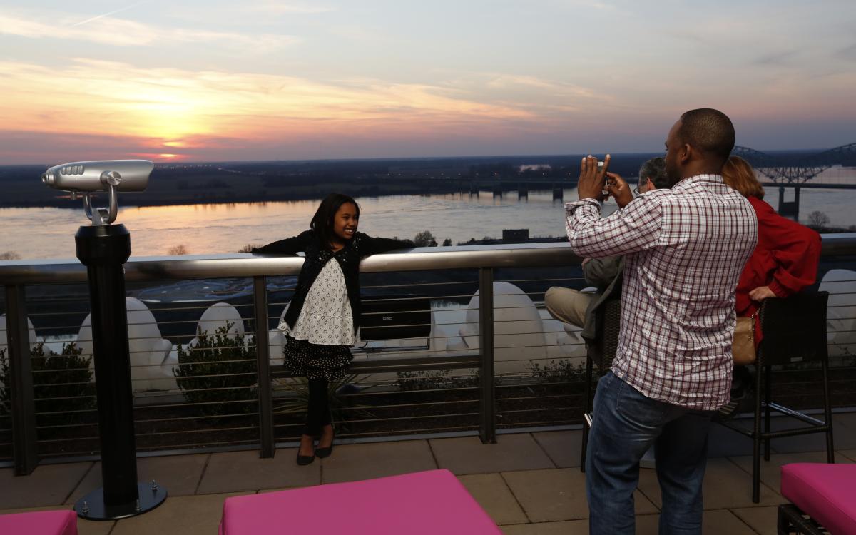 Family at Twilight Sky Terrace at the Madison Hotel. Photo Credit: Justin Fox Burks