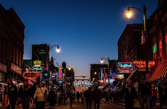 beale street at twilight with crowds and home of the blues sign