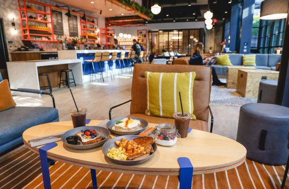 food on table inside of Talk Shop in Caption by Hyatt