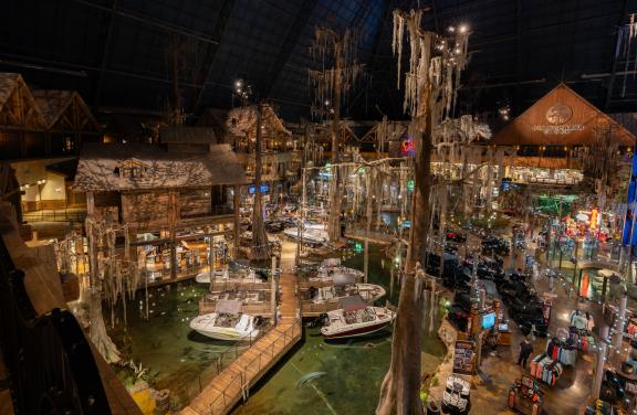 inside the bass pro pyramid where the store is designed to look like a cypress swamp with water and trees