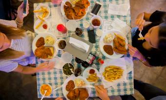 Four friends dine-in at Gus's Fried Chicken