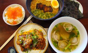 spread of ramen, rice, wontons, chicken at Good Fortune