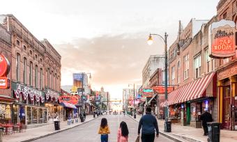 Family strolling Beale Street at sunset | Spring Break Family