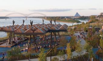 Tom Lee Park from above overlooking the playground, sunset canopy and the Mississippi River at dusk