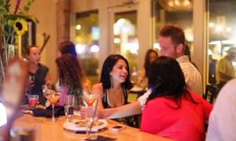 people enjoying drinks at alchemy's bar